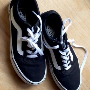 black with white stipe vans sneakers.